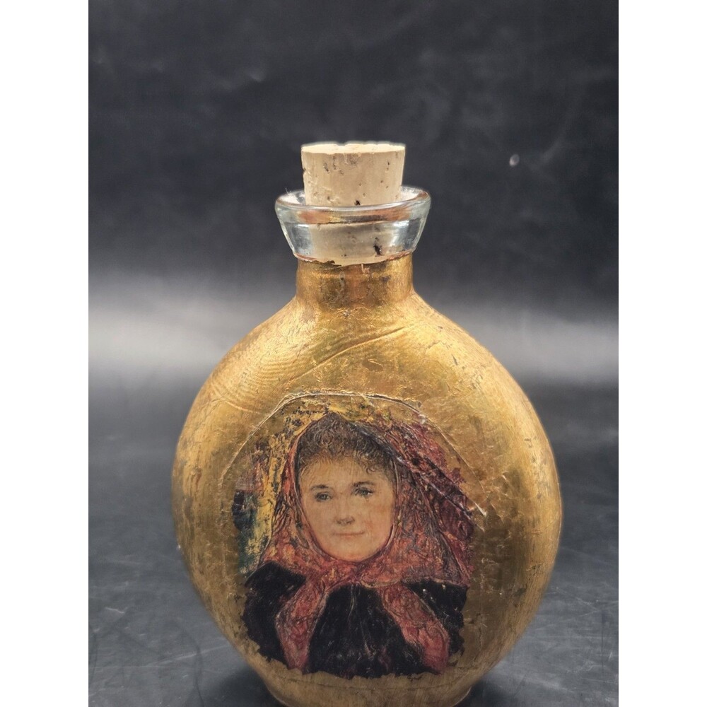 Weeping Gold Glass Bottle With Woman Wearing Headscarf Picture Label Attached